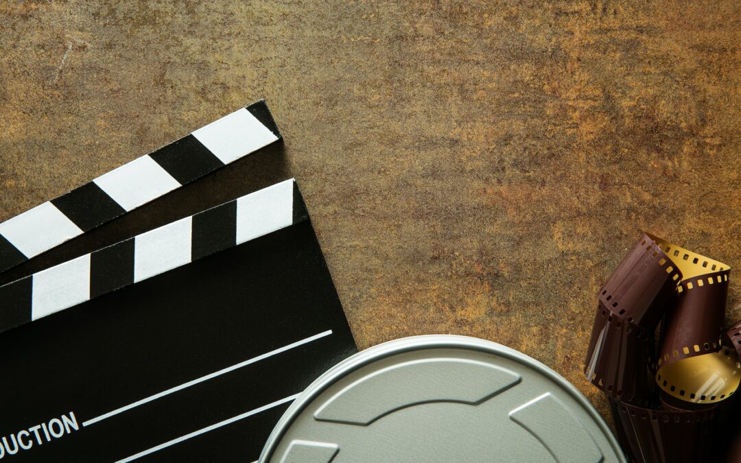 Clapper board with film reel.