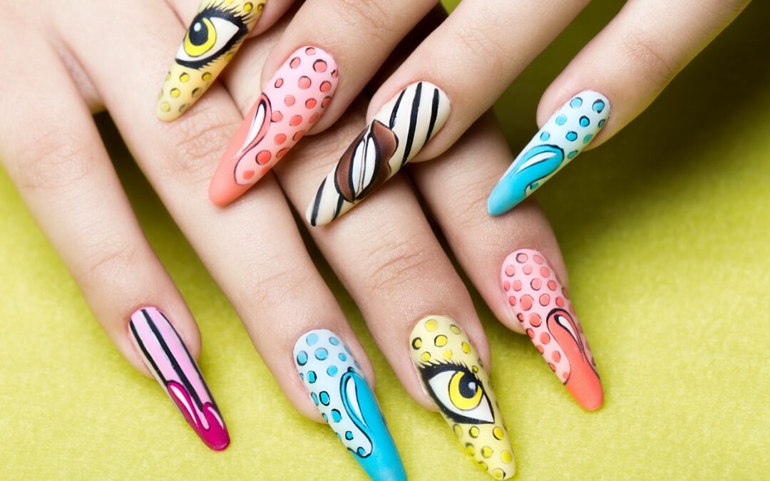 Long beautiful manicure in pop-art style on female fingers. Nails design. Close-up